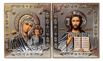 Två ortodoxa ikoner med Jungfru Maria och Jesusbarnet till vänster och Jesus Kristus till höger, i silver och guld.