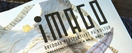 Omslag av tidningen Imago med en konstnärlig docka med vitt hår, bandage och sydda detaljer.