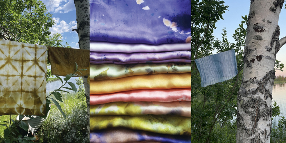 Färgglada tygstycken hänger utomhus mellan träd, med vikta tyger i mitten.