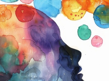 Abstrakt akvarellmålning av ett människohuvud med färgglada bubblor som symboliserar tankar.