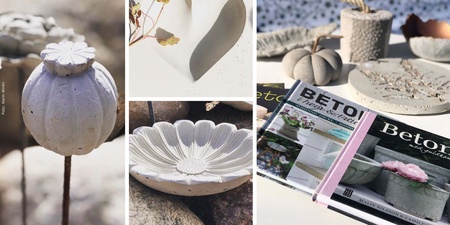 Flera betongdekorationer i form av blommor, frökapslar och hjärtan samt böcker om betongpyssel på ett bord.