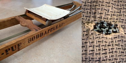 närbild på lagad reva i tyg med synliga stygn.