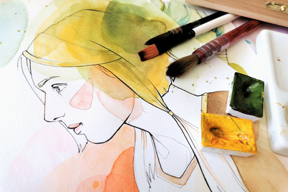 Akvarellmålning av en kvinna i profil med penslar och färgpalett bredvid.