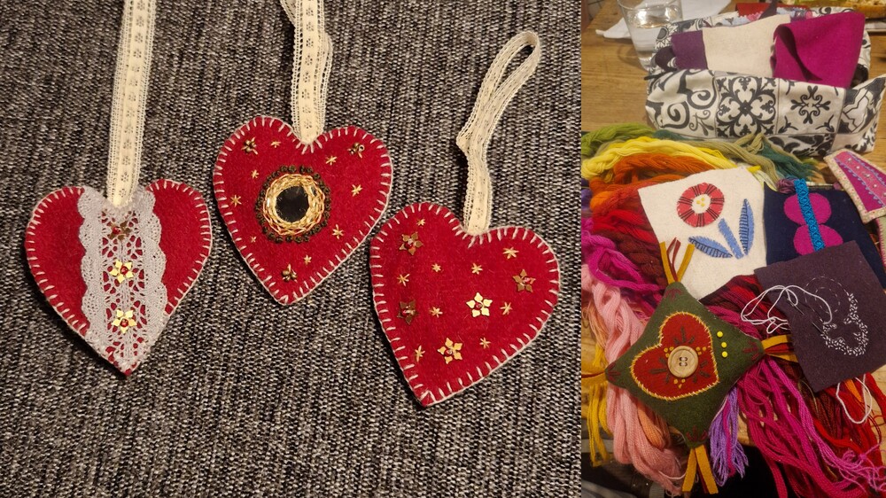 Handgjorda hjärtformade prydnader och broderade textilier i färgglada tyger och garn.
