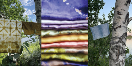 Färgglada tygstycken hänger utomhus mellan träd, med vikta tyger i mitten.