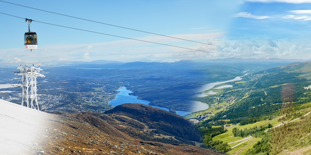 Panoramabild av fjäll med en kabinbana, sjö och grönskande landskap under blå himmel.