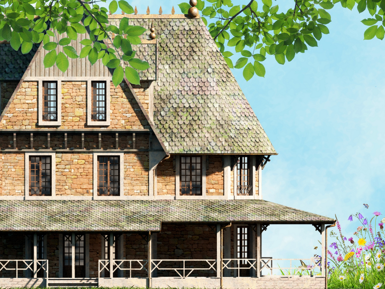 Stenhus med brant tak, veranda och blommande trädgård under blå himmel.